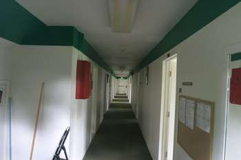 View thru front door down barracks hallway